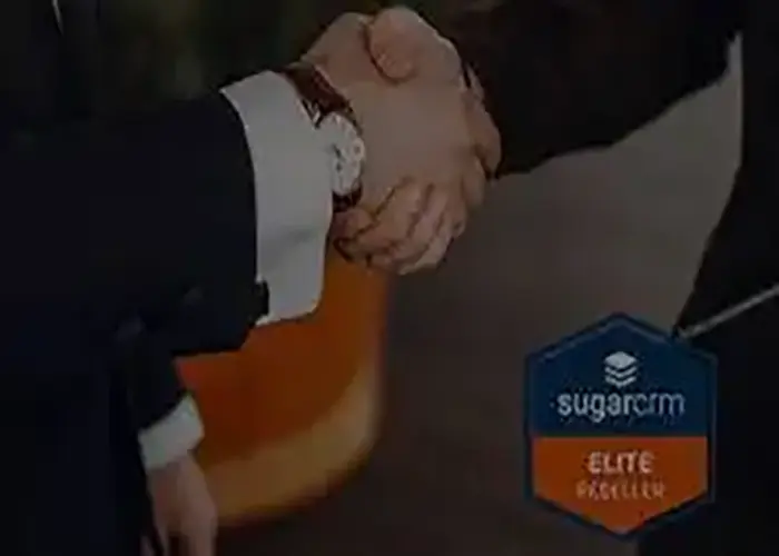 Business professionals shaking hands beside a SugarCRM Elite Partner badge, highlighting Ambit Software’s recognition as an Elite Partner by SugarCRM.