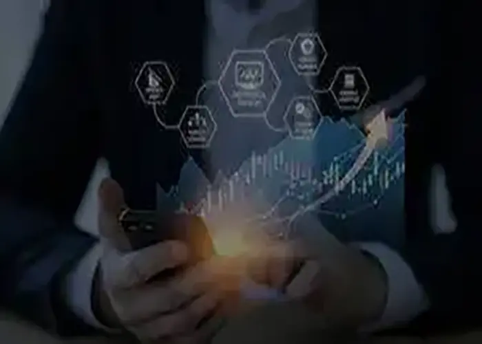 Business professional using a smartphone with digital analytics graphics showing business growth and technology solutions.