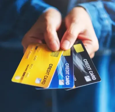 closeup-image-of-a-woman-holding-and-showing-credi-2024-11-27-11-44-32-utc